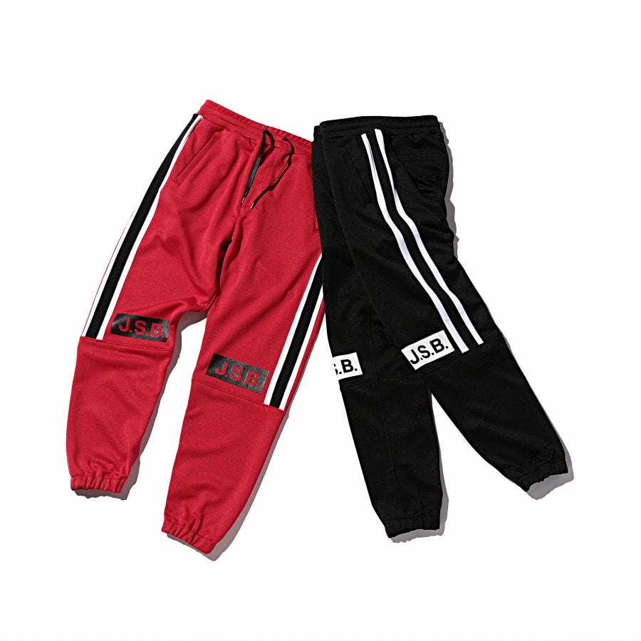 red and yellow track pants